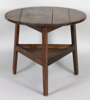 Lot 201 - A George III elm cricket table, the four plank...