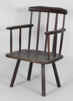 Lot 211 - An early 19th century oak primitive armchair,...