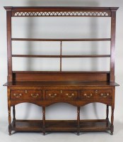 Lot 221 - A George III oak high dresser, Mid Wales, the...