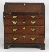 Lot 223 - A George III oak fall front bureau the fall...