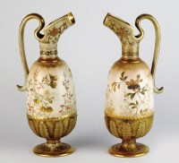 Lot 98 - A pair of Doulton Burslem blush ivory ewers,...