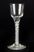 Lot 102 - An ogee-bowl wine glass, circa 1765, set on a...