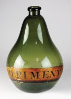 Lot 109 - A 19th century apothecary's green glass...