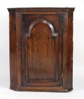 Lot 173 - A George III oak wall hanging straight fronted...