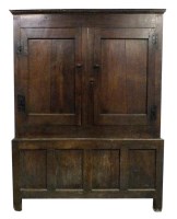 Lot 174 - A mid 18th century oak livery cupboard, the...