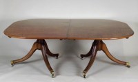 Lot 215 - A George IV mahogany twin pillar dining table,...