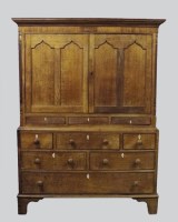 Lot 225 - A 19th century oak livery cupboard, possibly...