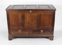 Lot 235 - A George III oak mule chest, the three panel...