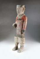 Lot 4 - A Chinese painted pottery tomb figure of an...