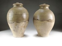 Lot 9 - A matched pair of Chinese glazed pottery...