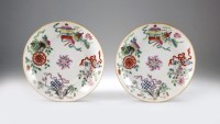 Lot 77 - A pair of Chinese famille rose saucers,...