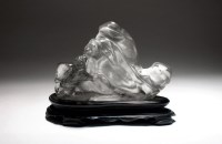 Lot 123 - A Chinese rock crystal carving of a tiger on...