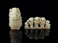 Lot 133 - Two Chinese carved jade figures, 19th century,...