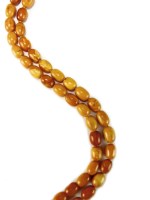 Lot 137 - An amber bead necklace, comprising a...