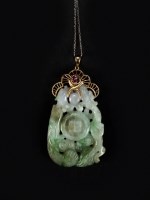 Lot 139 - A Chinese jade pendant, Qing, the white stone...