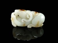 Lot 146 - A Chinese nephrite jade figure of a ram,...