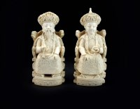 Lot 188 - A pair of Chinese ivory figures of an emperor...