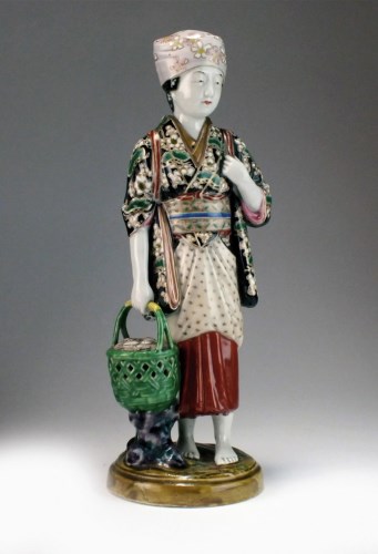 Lot 225 - A Japanese Kutani figure of a maiden,...