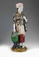 Lot 225 - A Japanese Kutani figure of a maiden,...