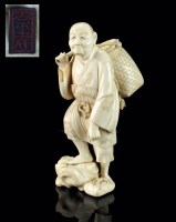 Lot 234 - A Japanese ivory okimono of a farmer, Meiji...