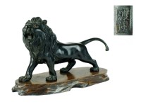 Lot 247 - A Japanese bronze figure of a lion, Meiji...
