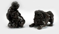 Lot 259 - Two Japanese carved wood netsuke, 19th century,...