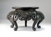 Lot 284 - A Chinese carved hongmu vase stand, Qing, 19th...