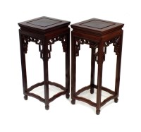 Lot 291 - A pair of Chinese rosewood vase stands, 20th...