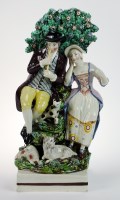 Lot 8 - A Staffordshire group of a Shepherd and...