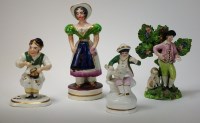 Lot 14 - Three Victorian Staffordshire figures,...