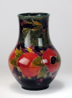 Lot 94 - A William Moorcroft pottery baluster vase in...