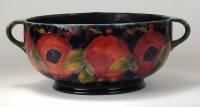 Lot 96 - A William Moorcroft pottery twin handled bowl...