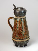 Lot 97 - A Doulton Lambeth stoneware jug with metal...