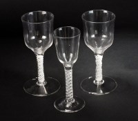 Lot 102 - Two large wine glasses, the opaque bowls above...