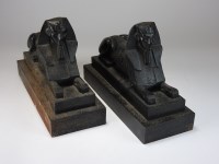 Lot 125 - A pair of black painted cast iron sphinx...