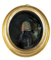 Lot 129 - A George III wax portrait relief bust of a...