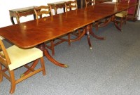 Lot 180 - A 20th century mahogany tri pillar dining...