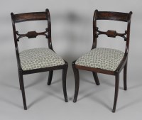 Lot 201 - A set of six Regency mahogany sabre leg dining...