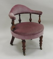 Lot 209 - A Victorian walnut tub chair, the arched back...