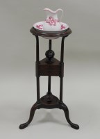 Lot 213 - A George III mahogany washbowl stand with two...