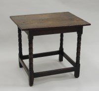 Lot 273 - An early 18th century oak tavern table, the...