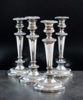 Lot 3 - A set of four Old Sheffield plate candlesticks,...