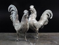 Lot 4 - A pair of white metal cockerel table ornaments,...