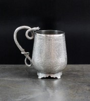 Lot 7 - An Indian white metal mug, of baluster form...