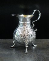 Lot 9 - A George II silver cream jug, GH, London 1750,...