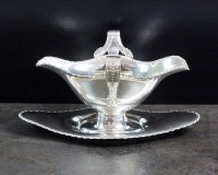 Lot 16 - A silver sauce boat and stand, Barker Brothers,...