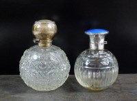 Lot 31 - A silver topped glass scent bottle, F H Adams...