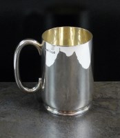 Lot 42 - A silver mug, L & W, Sheffield 1945, of plain...