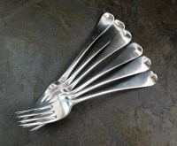 Lot 91 - A matched set of silver table forks, various...