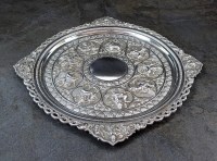 Lot 107 - An Indian white metal salver, of circular form...